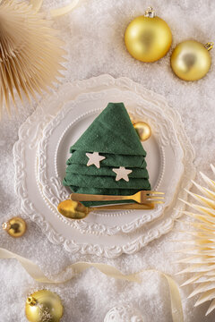 Modern white dining arrangement with Christmas decor.