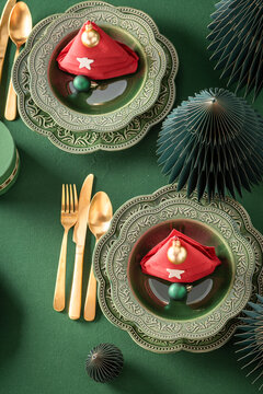 Modern green table display with festive baubles.