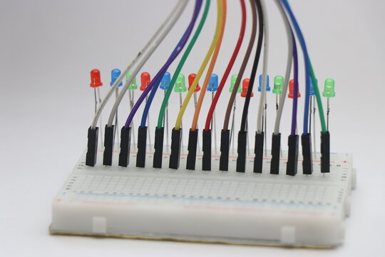 Light emitting diode arranged on a breadboard showing the concept of electronics prototyping