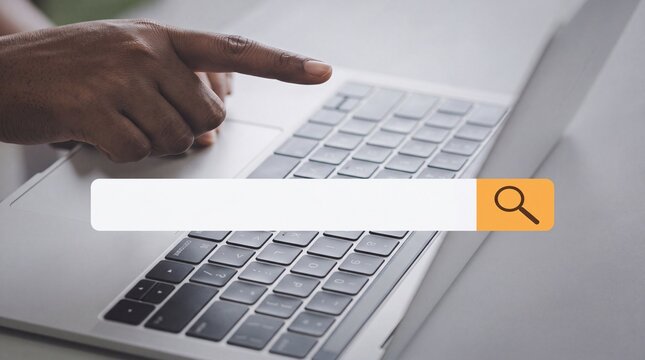 Search bar concept photo. Person using silver laptop computer with keyboard. Digital research