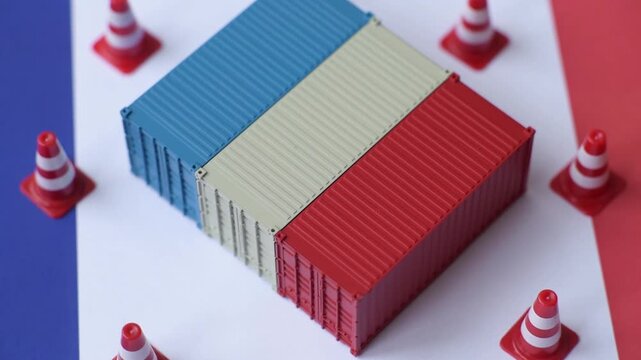 The cargo container ban on the French flag as a conceptual backdrop. Cargo container embargo