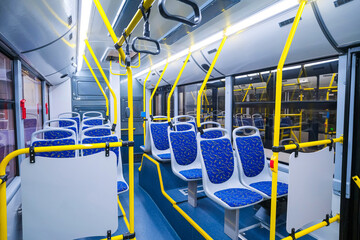 Empty bus interior. Seats without passengers. Public transport. © SGr