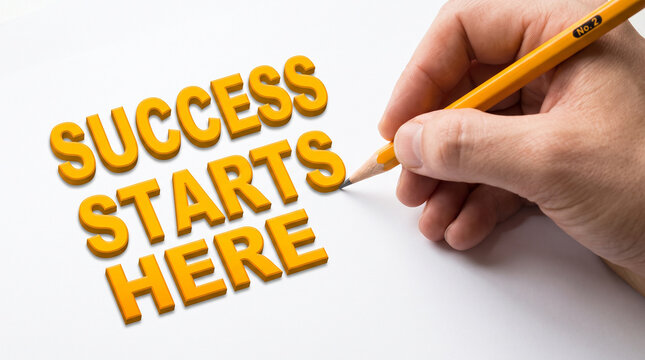 Hand writing success starts here on white paper with yellow wooden pencil expressing motivation and determination