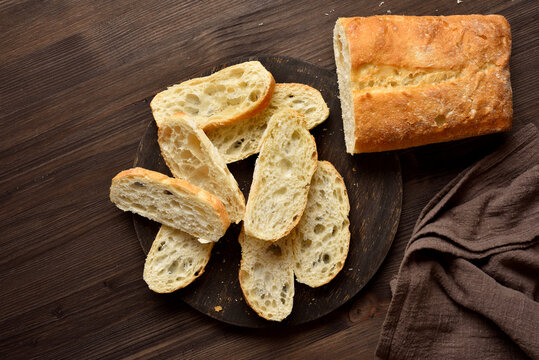Slices of ciabatta bread on cutting board