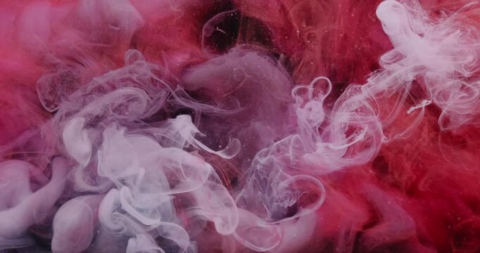 Paint mix. Fume drop explosion. Blur red blue purple color water dye liquid particles acrylic cloud texture spreading on abstract background.