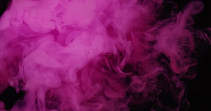 Vapor splash. Pink ink texture. Defocused color bright cloud water art pigment spreading on abstract acrylic dark black background.