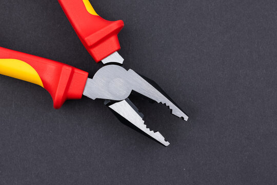 yellow orange pliers, plier tool. industry tools
