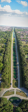 Aerial drone view of Royal Palace of Caserta and vast surrounding gardens in summer