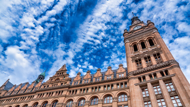 Milwaukee City Hall clock tower standing tall with historic architecture and blue sky
