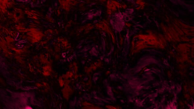 Textured background animation swirls in deep red and magenta hues. Smooth fluid liquid marble curves blend across the background. Dramatic ambient visual depth defines the textured background.