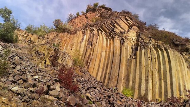 Ground view of basalt prisms near Sylce in Ukraine&rsquo;s Carpathians, hexagonal volcanic formations created by lava cooling millions of years ago, illuminated by autumn sunset light