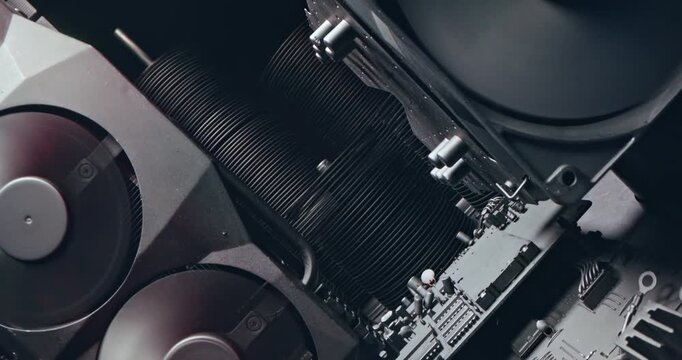 Working motherboards, fans and graphic cards. Camera move along components.