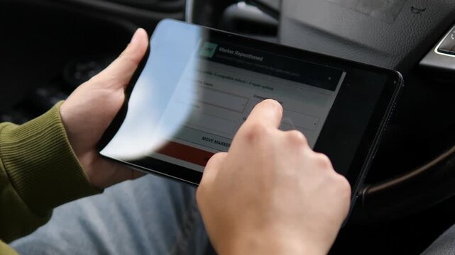 Tablet-based vehicle claims workflow captures windshield damage as a user repositions markers and updates repair options in a fast, data-driven auto inspection process.