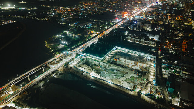 Illuminated city and metro line at night aerial nightscape cityscape lights