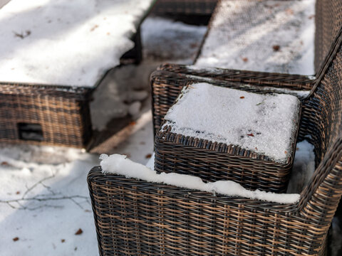 garden furniture covered with snow