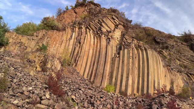 Ground view of basalt prisms near Sylce in Ukraine&rsquo;s Carpathians, hexagonal volcanic formations created by lava cooling millions of years ago, illuminated by autumn sunset light