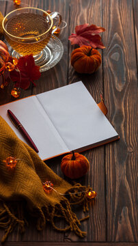 Cozy Autumn Still Life Scene With Tea Pumpkins And Open Notebook Ready For Writing
