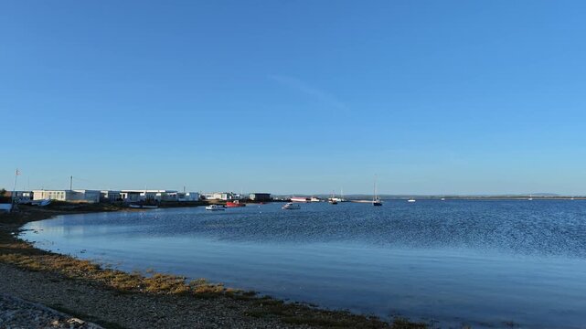Hayling Island Hampshire England UK. 05.09.2026. Video. A sweeping view across  scenic Langstone Haarbour with holiday waterfront homes. UK.