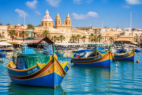 Colorful fishing boats moored in mediterranean harbor town waterfront