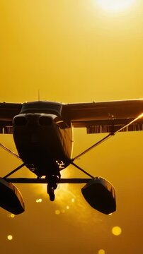 A small plane soaring through the sky as the sun sets in the background