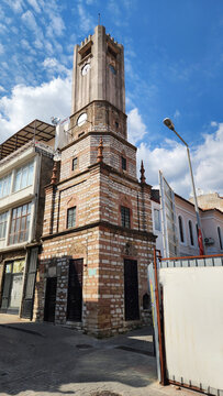 Historic Muğla Clock Tower at the entrance of Arasta Bazaar, built in 1885 by Filvari Usta, featuring a five-story square structure that narrows upward and combines altern