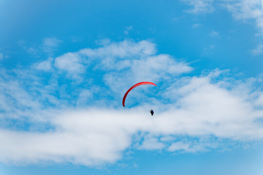 Paragliding sport activity. Parachute in the sky. Extreme rest and paragliding. Summer vacation. Extreme sport. Parachute paraglide. Sport and activity lifestyle. Paraglider paragliding recreation