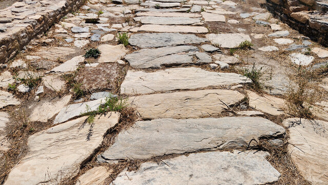A broad stone-paved road in Stratonikeia Ancient City, Yatağan, Muğla, reflecting the layered urban fabric where ancient Roman street architecture blends with later Ottoman and early Republican tradit