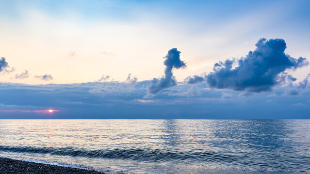 panoramic view of blue clouds with setting sun
