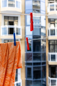 clothespin holds washed clothes drying on rope