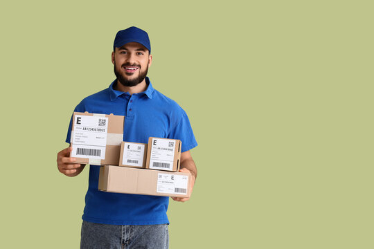 Logistics and express delivery service, smiling courier holding cardboard parcels for shipping and e-commerce distribution on a solid green background