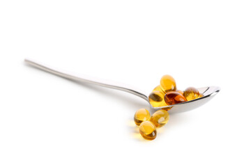 Fototapeta premium Healthcare and dietary supplement concept, omega 3 fish oil capsules on a metal spoon for daily vitamin intake and medical nutrition therapy