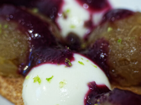 Macro of panna cotta with fruit compote and hazelnut dacquoise