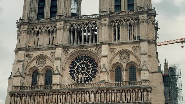 On a cloudy day in Paris, Notre-Dame Cathedral currently undergoing restoration following the fire is once again the site of ongoing architectural restoration work.
