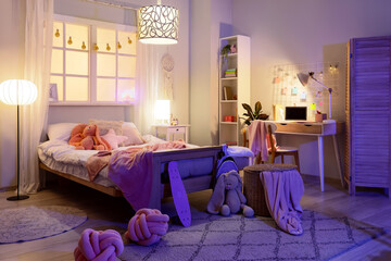 Teenage bedroom interior, remote learning and study space for student with desk and laptop in cozy home environment at night with warm lighting © Pixel-Shot