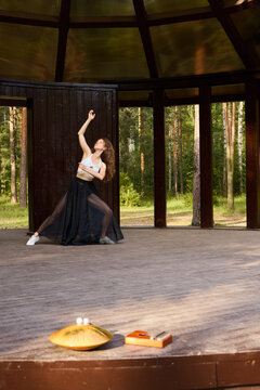 Caucasian ballerina dramatic interpretive reach on stage