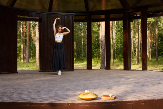 Artistic performer improvises style while basking in outdoor sunlight