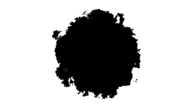 Black ink blot expanding on white background, organic paint splatter transition effect