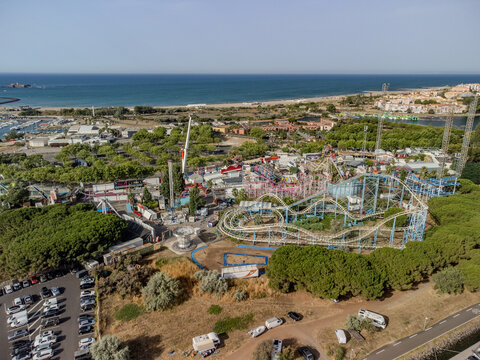 Aerial view of Cap d&rsquo;Agde marina on the Mediterranean coast in Occitanie, H&eacute;rault, France, with yachts, waterfront buildings, and a sunny seaside holiday atmosphere.
