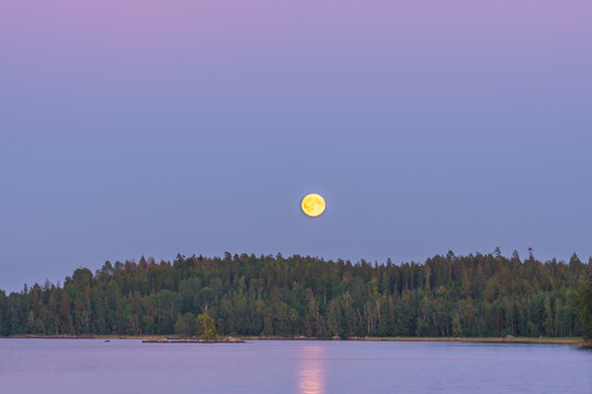Hallangen lake with moonlight at sunset in Kalmar region. Sweden