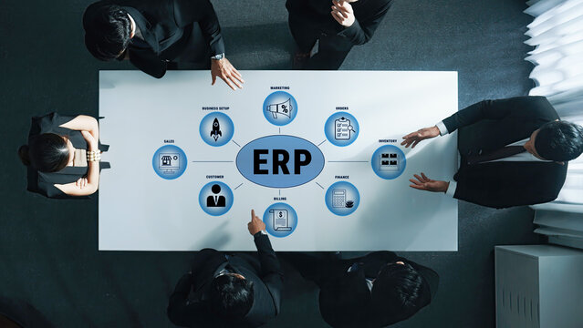 Business Meeting Discussing ERP Implementation Strategies and Models Around Table with Six Professionals Engaged in Active Discussion Quark.