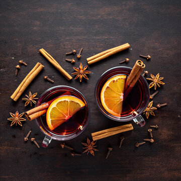 Two glasses of mulled wine with orange and cinnamon