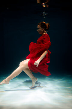 Serene underwater dance scene illustrating discipline and gracefulness