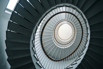 Fototapeta premium Low angle view of spiral staircase and handrail