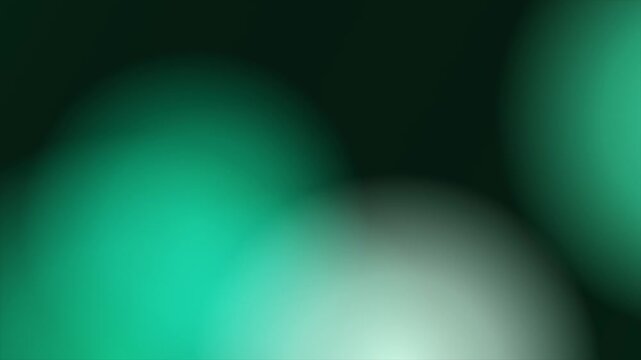 Green abstract background with glowing defocused lights or bokeh effect, soft gradient light blur for design