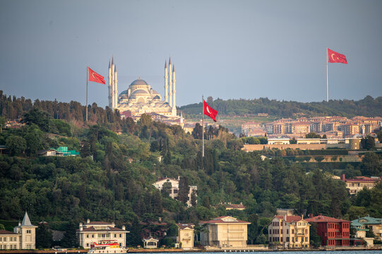 Istanbul,turkey,august 4, 2025. Camlica mosque and turkish flags dominating the istanbul cityscape and bosphorus strait, showcasing modern turkish architecture