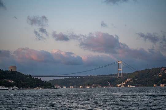 Istanbul,turkey,august 4, 2025. Fatih sultan mehmet bridge connecting europe and asia over the bosphorus strait in istanbul, turkey, at sunset with rumeli hisari