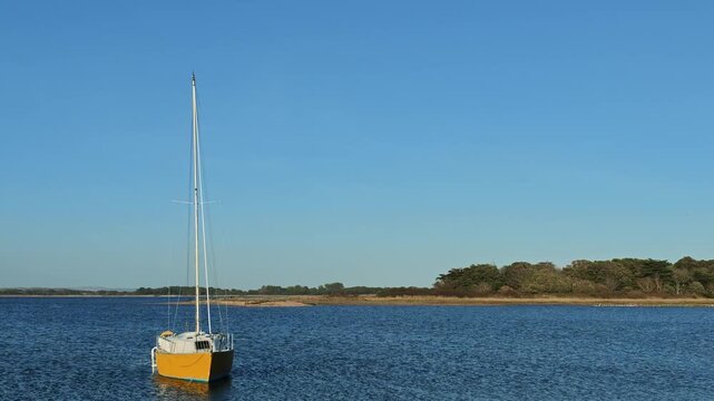 Hayling Island Hampshire England UK. 05.09.2026. Video. Single yacht on moorings on Langestone  Harbour popular holiday destination Hampshire UK