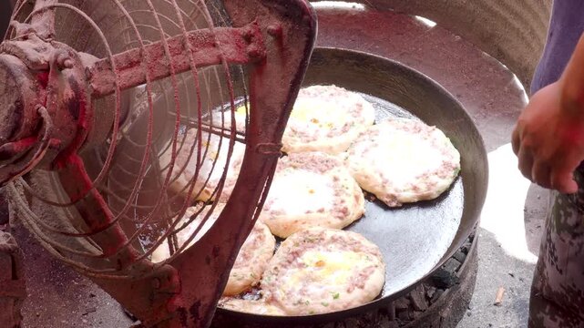 Ancient bread bakery and bread ovens, baking flat bread, traditional handicraft in Xizhou, Yunnan, China