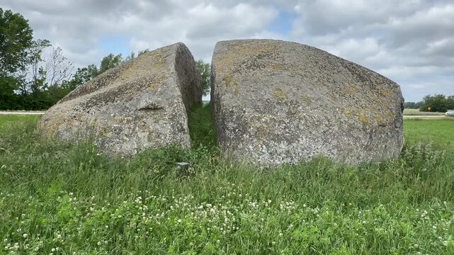 The Split Stone, a split stone block that is 14 m. long, 9 m. wide and 3 m. high, lying in a field at Glemmingebro, Ystad Municipality, Sk&aring;ne County, Sweden, Scandinavia