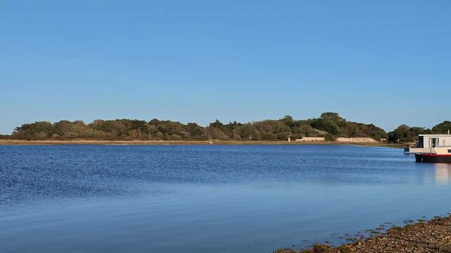 Hayling Island Hampshire England UK. 05.09.2026. Video. A sweeping view across  scenic Langstone Haarbour with holiday waterfront homes. UK.